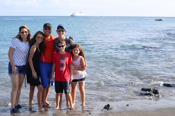 Family in the beach at the Galapagos Islands
